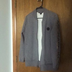 A small grey full zip wool Micheal Kors casual jacket with no hood
